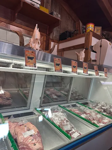 The butcher counter at Ashton Farms Custom Meats — fresh cuts behind the glass display case
